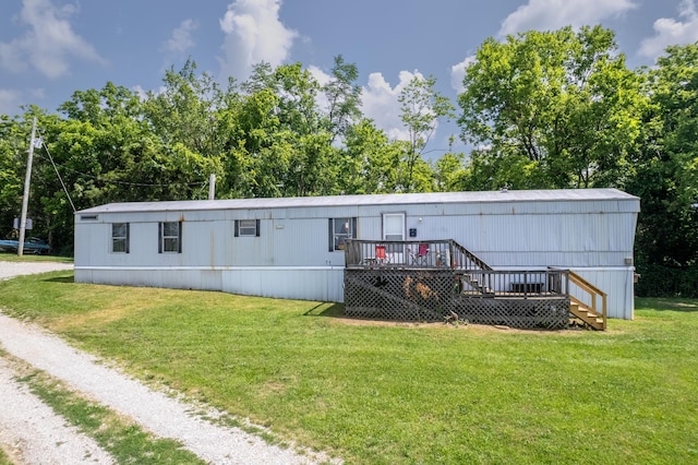 494 Janice Ln, Owingsville, KY 40360 - manufactured / mobile home with a wooden deck, a front yard, and stairs