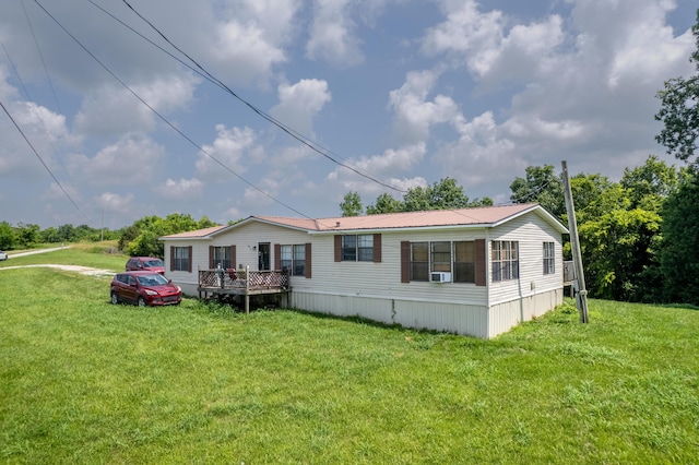 494 Janice Ln, Owingsville, KY 40360 - view of front of house with a front lawn, a wooden deck, and a metal roof