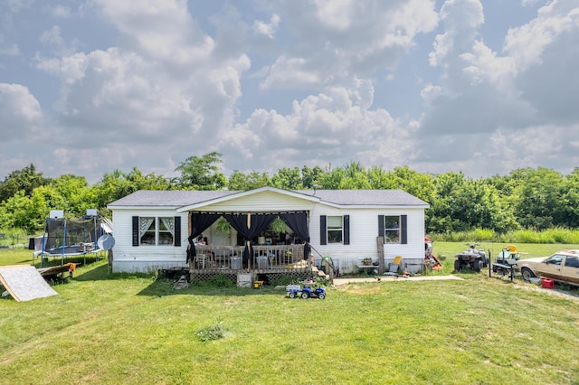 494 Janice Ln, Owingsville, KY 40360 - rear view of property with a trampoline, a yard, and a deck