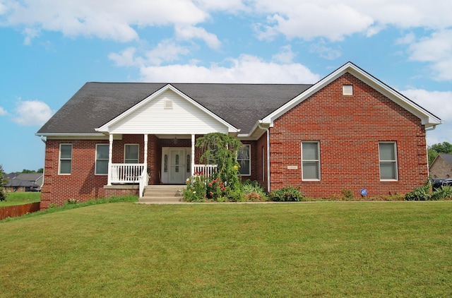 1016 Cedar Ridge Ln, Versailles, KY 40383 - view of front facade featuring brick siding, a front yard, and a porch