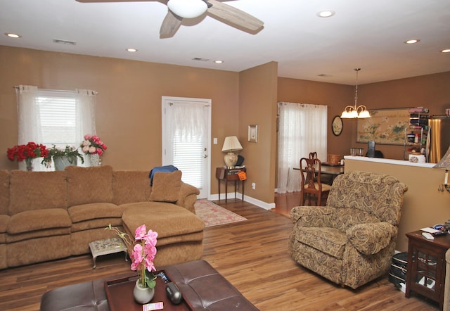 1016 Cedar Ridge Ln, Versailles, KY 40383 - living room featuring wood finished floors, a ceiling fan, recessed lighting, and a chandelier