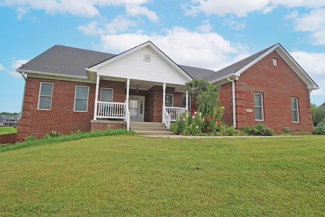 1016 Cedar Ridge Ln, Versailles, KY 40383 - view of front of house with brick siding, a front lawn, and a porch