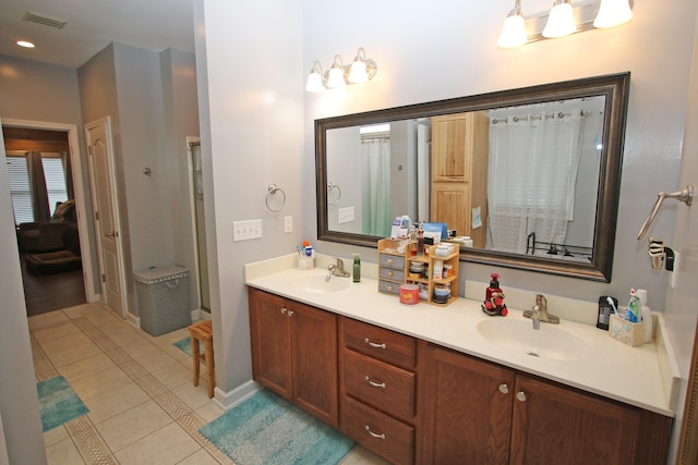 1016 Cedar Ridge Ln, Versailles, KY 40383 - ensuite bathroom featuring tile patterned floors, double vanity, a shower, and recessed lighting
