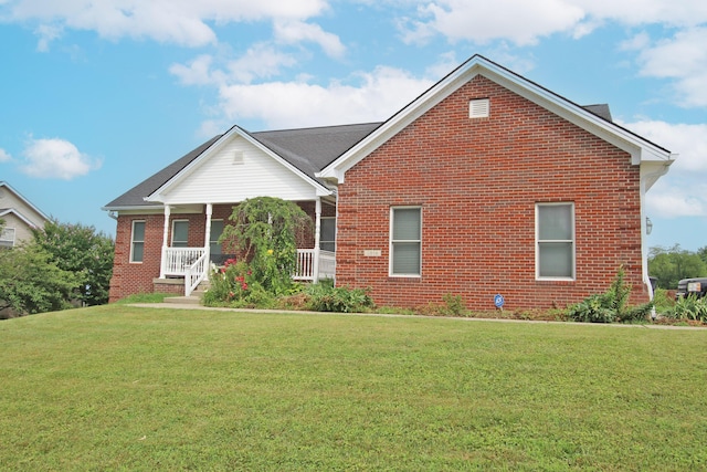 1016 Cedar Ridge Ln, Versailles, KY 40383 - view of front of house featuring brick siding, a front lawn, and a porch