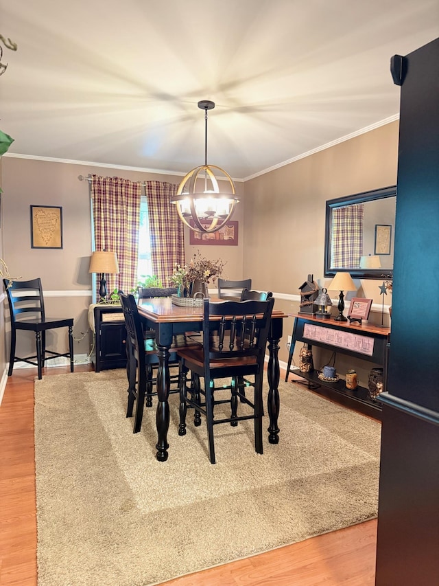 1310 Lago Dr, Frankfort, KY 40601 - dining space featuring a chandelier, crown molding, and wood finished floors