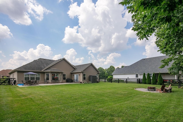 136 Rocky Creek Rd, Georgetown, KY 40324 - rear view of house featuring a fire pit, a patio, and a fenced backyard