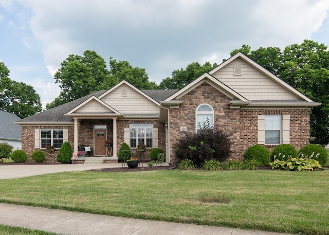 136 Rocky Creek Rd, Georgetown, KY 40324 - view of front of house with a front yard, brick siding, and a shingled roof
