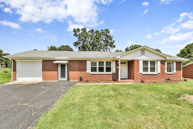 227 Gailane St, Lawrenceburg, KY 40342 - single story home with a garage, brick siding, driveway, a front lawn, and roof with shingles