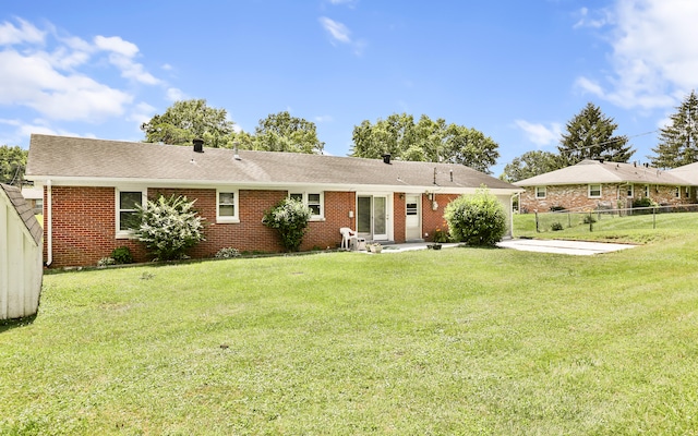 227 Gailane St, Lawrenceburg, KY 40342 - rear view of house with a patio, brick siding, and roof with shingles