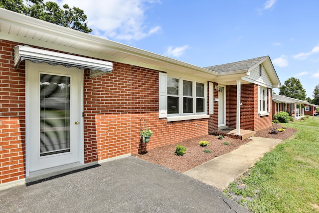 227 Gailane St, Lawrenceburg, KY 40342 - doorway to property with brick siding and roof with shingles