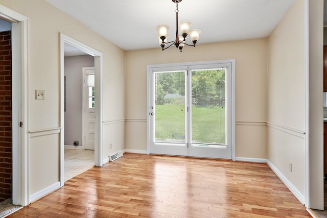 227 Gailane St, Lawrenceburg, KY 40342 - unfurnished dining area with plenty of natural light, light wood-type flooring, and a chandelier