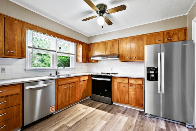 227 Gailane St, Lawrenceburg, KY 40342 - kitchen with appliances with stainless steel finishes, under cabinet range hood, brown cabinetry, ceiling fan, and crown molding