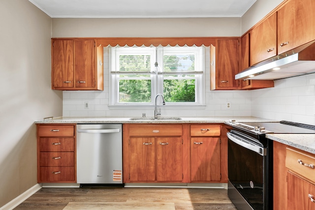 227 Gailane St, Lawrenceburg, KY 40342 - kitchen with electric range, stainless steel dishwasher, under cabinet range hood, brown cabinetry, and ornamental molding
