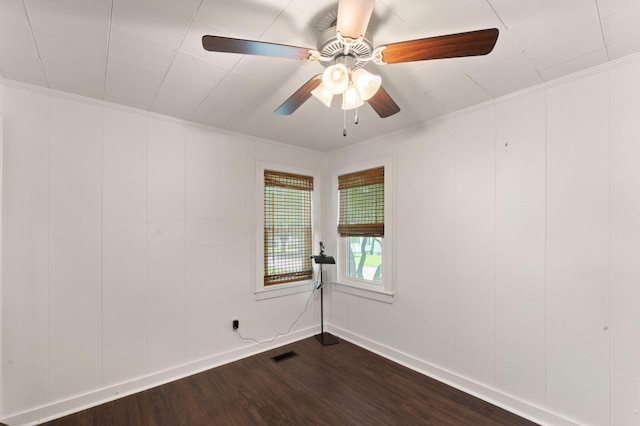 411 E Washington St, Franklin, KY 42134 - unfurnished room with dark wood-style floors, a decorative wall, ornamental molding, and a ceiling fan