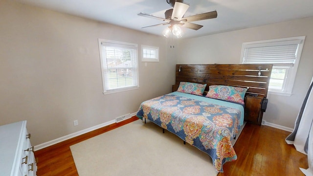 1010 Riverside Dr, Harrodsburg, KY 40330 - bedroom featuring multiple windows, wood finished floors, and ceiling fan