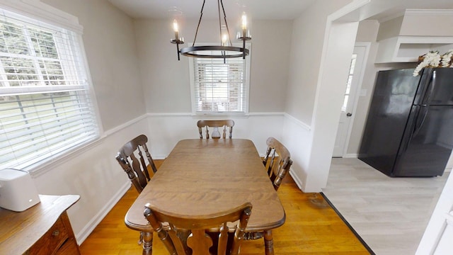 1010 Riverside Dr, Harrodsburg, KY 40330 - dining space with a chandelier and light wood-type flooring