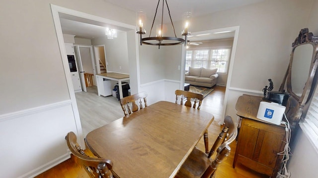 1010 Riverside Dr, Harrodsburg, KY 40330 - dining room with light wood-style floors, stairs, and a ceiling fan
