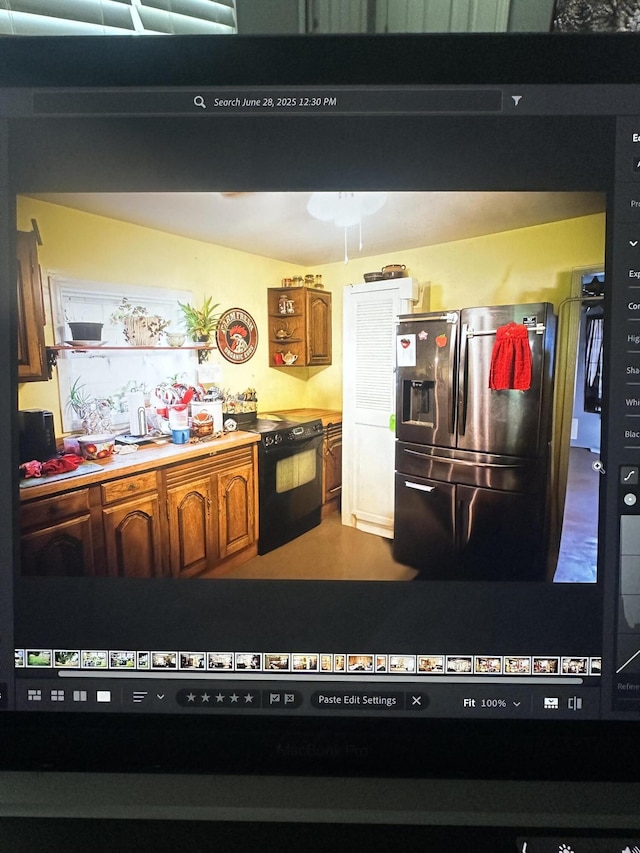 410 Oak St, Georgetown, KY 40324 - kitchen with stainless steel fridge with ice dispenser, electric range, and brown cabinets