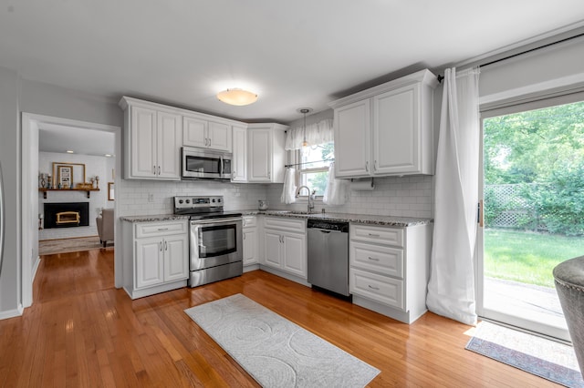 2864 Ark Royal Way, Lexington, KY 40503 - kitchen with stainless steel appliances, tasteful backsplash, and white cabinetry
