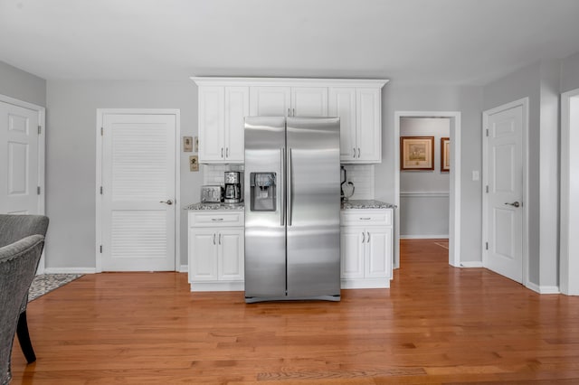 2864 Ark Royal Way, Lexington, KY 40503 - kitchen featuring stainless steel fridge, backsplash, light wood-style floors, and white cabinets