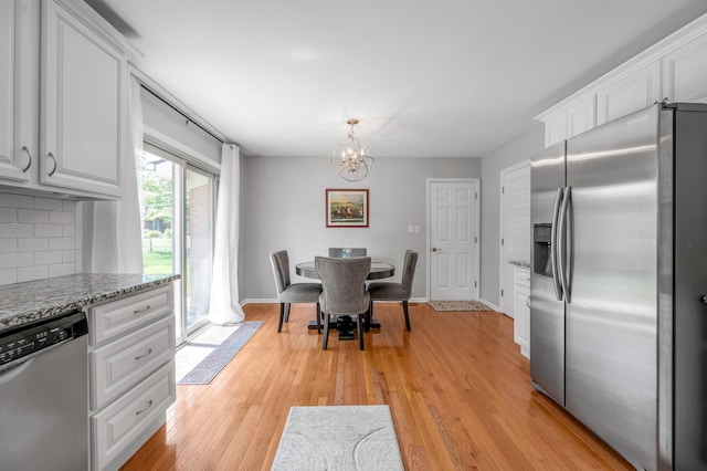 2864 Ark Royal Way, Lexington, KY 40503 - kitchen featuring stainless steel appliances, a chandelier, and white cabinetry