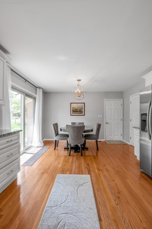2864 Ark Royal Way, Lexington, KY 40503 - dining area with a chandelier and light wood-type flooring