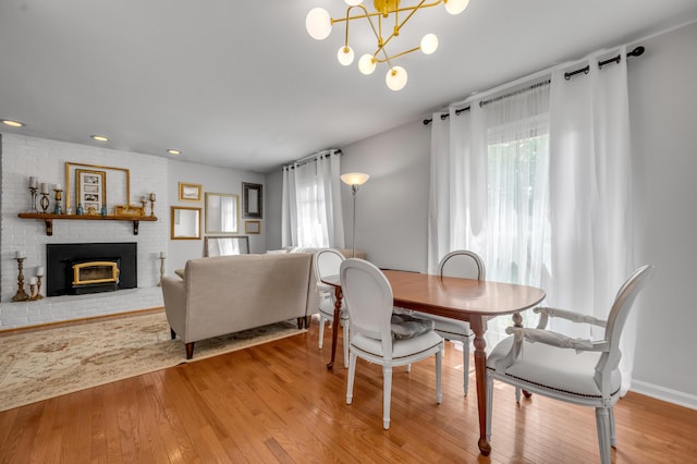 2864 Ark Royal Way, Lexington, KY 40503 - dining room featuring wood finished floors, a fireplace, a chandelier, and recessed lighting