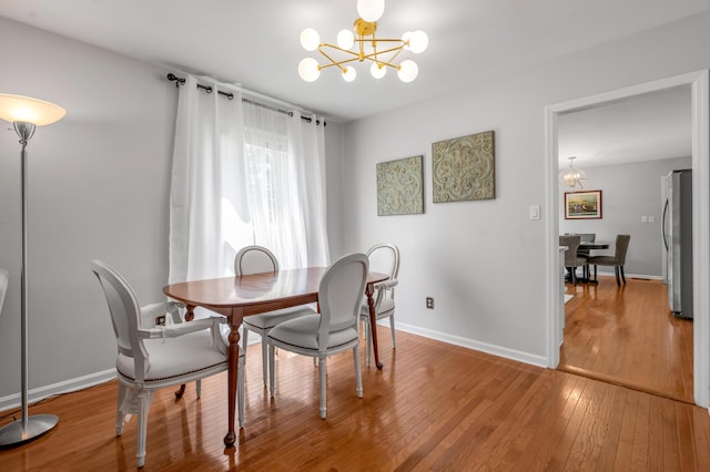 2864 Ark Royal Way, Lexington, KY 40503 - dining area featuring a chandelier and light wood-style floors