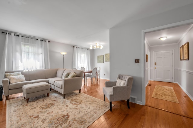 2864 Ark Royal Way, Lexington, KY 40503 - living room featuring hardwood / wood-style floors, ornamental molding, and a chandelier