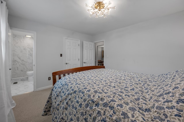 2864 Ark Royal Way, Lexington, KY 40503 - bedroom with a chandelier, marble look tile flooring, and ensuite bath