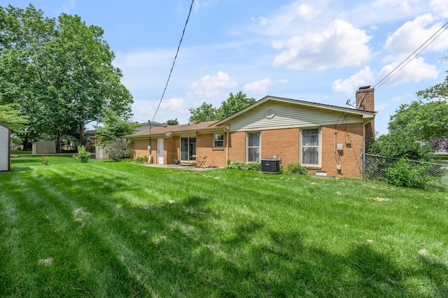 2864 Ark Royal Way, Lexington, KY 40503 - rear view of property with a chimney and brick siding