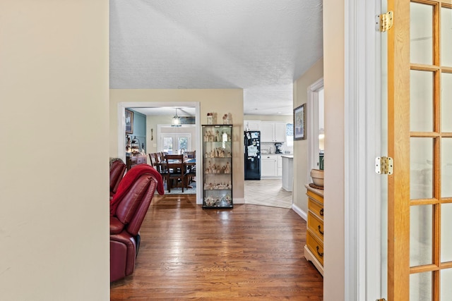 997 Copper Creek Rd, Berea, KY 40403 - foyer entrance with wood finished floors, healthy amount of natural light, and a textured ceiling