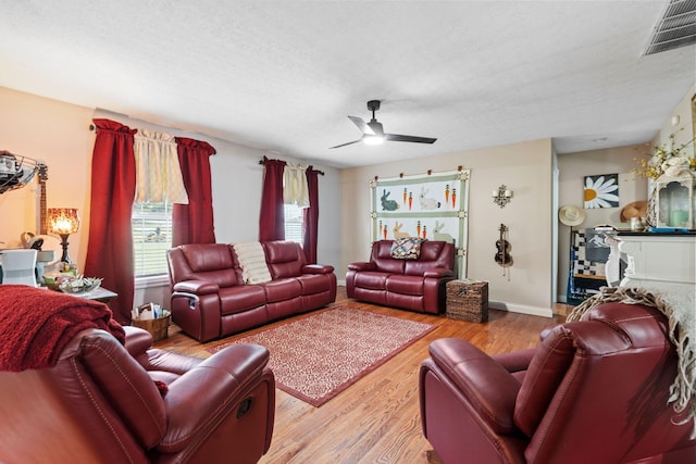 997 Copper Creek Rd, Berea, KY 40403 - living room with healthy amount of natural light, ceiling fan, wood finished floors, and a textured ceiling