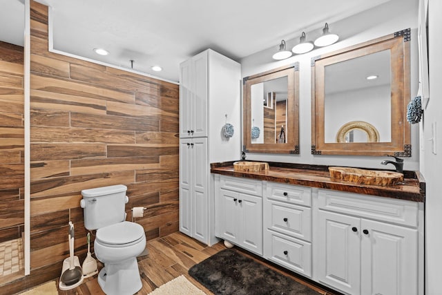 997 Copper Creek Rd, Berea, KY 40403 - bathroom with double vanity, wood finished floors, recessed lighting, and wood walls