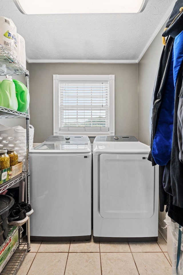 997 Copper Creek Rd, Berea, KY 40403 - laundry area with separate washer and dryer, light tile patterned floors, a textured ceiling, and ornamental molding