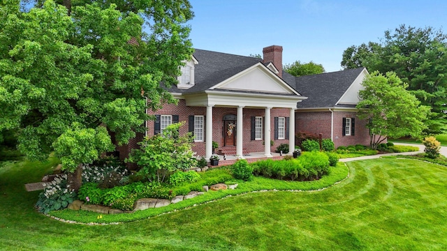 30 Woodburn St, Frankfort, KY 40601 - greek revival inspired property with a chimney, a front lawn, and brick siding