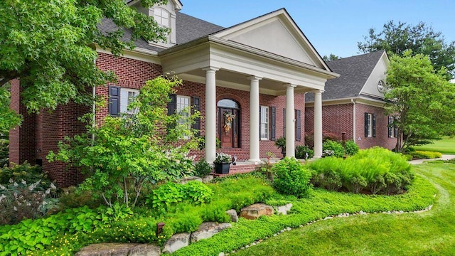30 Woodburn St, Frankfort, KY 40601 - greek revival inspired property with brick siding, roof with shingles, and covered porch