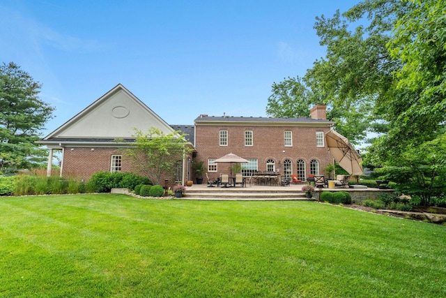 30 Woodburn St, Frankfort, KY 40601 - rear view of property with a patio area, a lawn, a chimney, and brick siding