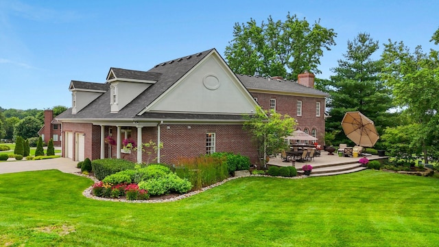 30 Woodburn St, Frankfort, KY 40601 - view of property exterior featuring a yard, concrete driveway, brick siding, and a chimney