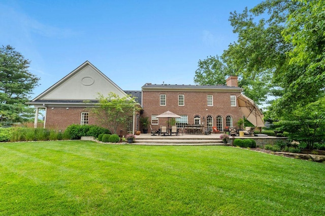 30 Woodburn St, Frankfort, KY 40601 - back of house with a chimney, a yard, a patio area, and brick siding
