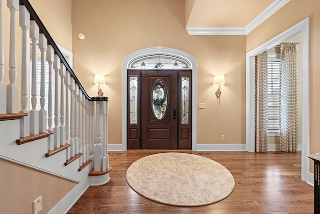 30 Woodburn St, Frankfort, KY 40601 - foyer featuring stairway, wood finished floors, and crown molding