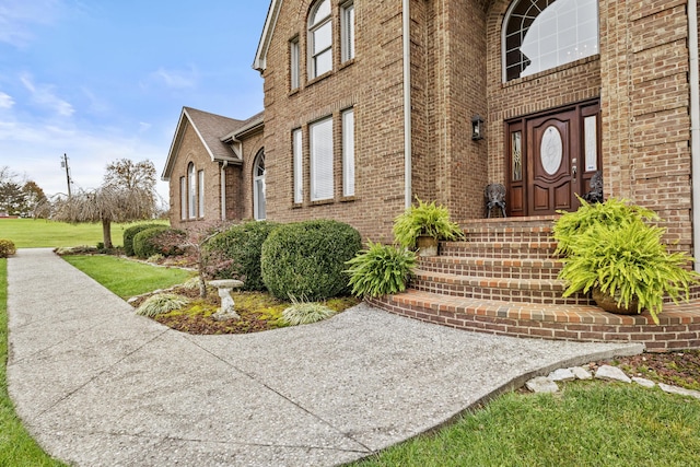 117 Richland Dr, Richmond, KY 40475 - view of exterior entry featuring brick siding and a lawn