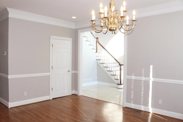 117 Richland Dr, Richmond, KY 40475 - spare room featuring wood finished floors, a chandelier, stairs, ornamental molding, and recessed lighting