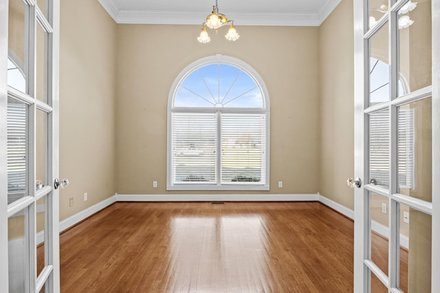 117 Richland Dr, Richmond, KY 40475 - unfurnished room with a chandelier, wood finished floors, french doors, and crown molding