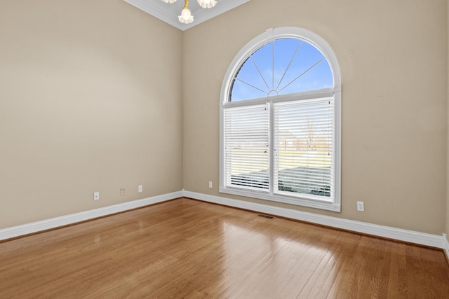117 Richland Dr, Richmond, KY 40475 - unfurnished room with wood finished floors, crown molding, and a chandelier