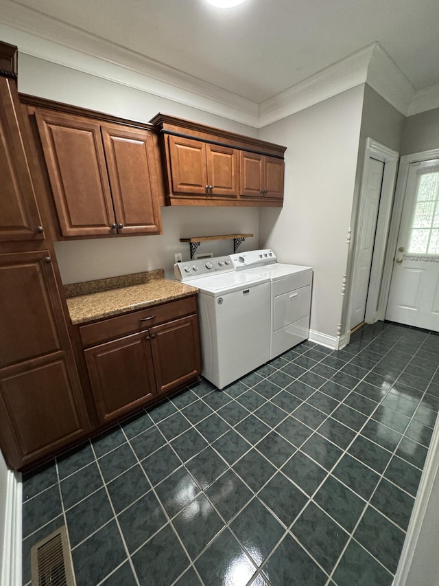 117 Richland Dr, Richmond, KY 40475 - washroom featuring cabinet space, washing machine and dryer, ornamental molding, and dark tile patterned floors