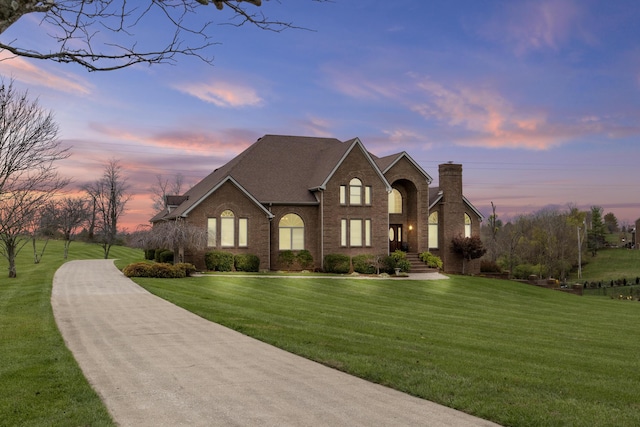 117 Richland Dr, Richmond, KY 40475 - traditional-style house featuring brick siding, a front yard, and a chimney
