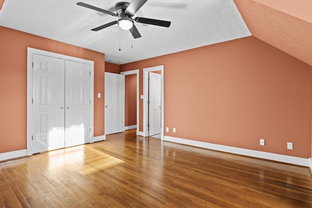 117 Richland Dr, Richmond, KY 40475 - unfurnished bedroom with wood finished floors, a closet, a ceiling fan, lofted ceiling, and a textured ceiling