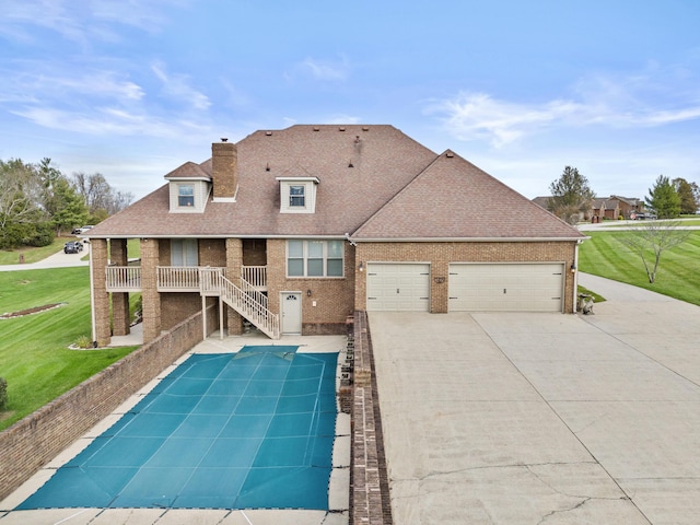 117 Richland Dr, Richmond, KY 40475 - view of swimming pool featuring a lawn, stairs, and covered porch
