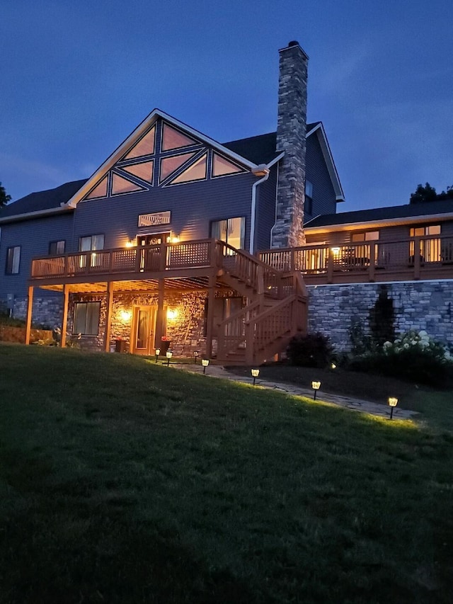 5134 Peaks Mill Rd, Frankfort, KY 40601 - back of house at twilight with a lawn, a chimney, and a wooden deck
